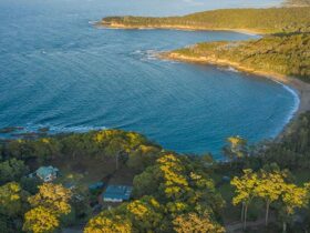 Aerial view of Judges House (right), neighbouring Yellow Rock Beach House and the coastline,