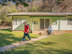 Family sets off to go hiking from Post Office cottage. Photo: OEH/John Spencer