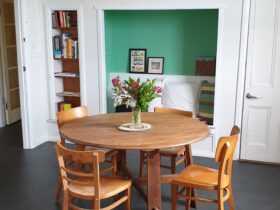 Dining table and four chairs in the upstairs dining area