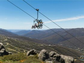 Mountain bikers taking a chairlift to the top of the Thredbo Valley Track