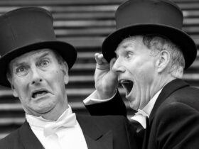 David Hobson and Colin Lane in top hats mucking around