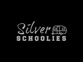 Logo of silver caravan and text Silver Schoolies