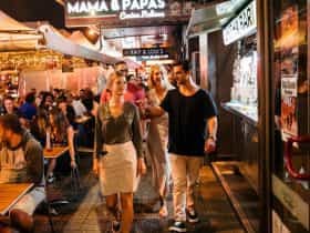 People dining at restaurants along Eat Street dining precinct in Parramatta
