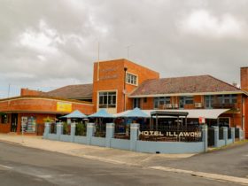 Image of Hotel Illawong, blue bring frontage and heritage brick.