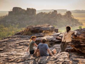 Visitors looking over the Kakadu landscape with an Aboriginal guide from Kakadu Cultural Tours