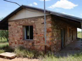 The second, 3-roomed building at the site, showing evidence of vandalism and poor restoration techniques.