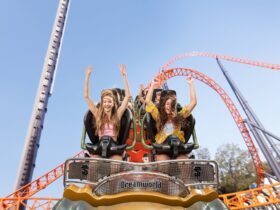 Two teens riding the Steel Taipan rollercoaster at Dreamworld