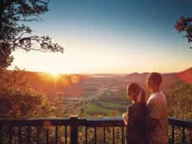 Couple at Sky Window lookout with Pioneer Valley view.