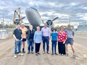 Members in front of Dakota C-47 aircraft with local & State Tourism representatives