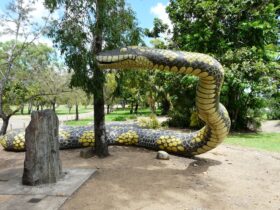 The Gudjuda Reference Group commissioned the large carpet snake sculpture Gubulla Munda Dreaming (2004), which was painted by aboriginal artists and stands on a sacred site, along with several plaques and a memorial stone, in Plantation Park, Ayr, North Queensland.