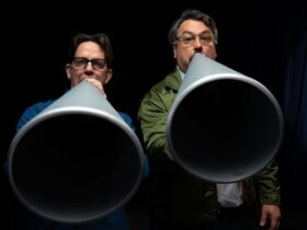 They Might Be Giants - two people holding up megaphones to their mouths