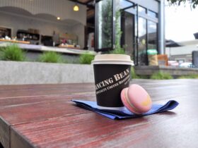 Photo of Coffee and Macaroon with Dancing Bean Espresso Bar in the background