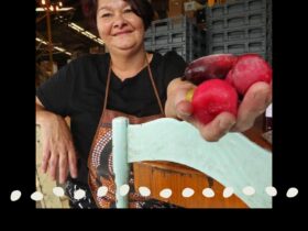 Aunty Dale Chapman holding Davidson Plum and Finger Lime