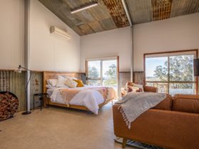 Open plan bedroom. Wake up to sweeping valley views.