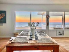 Open plan living and dining sea view