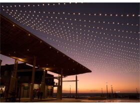 Henley Square at sunset, festoon lighting and building in silhouette