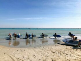 Group of paddlers heading out at Southend beach for a group session.