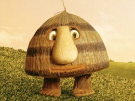 Grug is a character who resembles a haystack, with eyes, a large nose and feet.