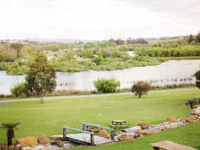 View from restaurant of lawns, creek and lake.