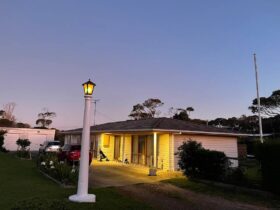 Front of house at twilight showing street lamp in front of house