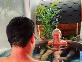Couple in an ice bath with infrared sauna within Flow's serene and beautiful contract therapy garden