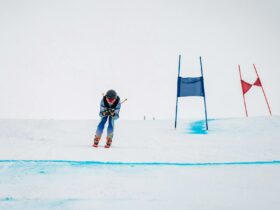 person skiing down race track