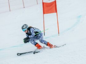 child skiing down race track