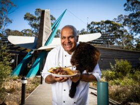 Head Chef Kevin Murray holds a plate of food outside the Bush Cafe in East Gippsland.