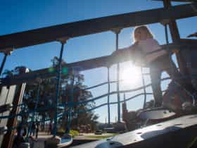 Girl on a moving bridge in the Boundless Playground