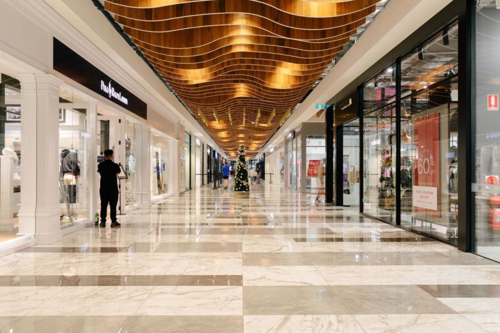 Corridor of shops at an outlet centre in Canberra.