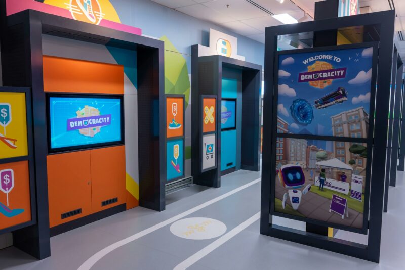 Touchscreens displaying the DemocraCity game
