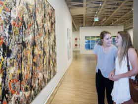 Women looking at art in the National Gallery of Australia, 2015