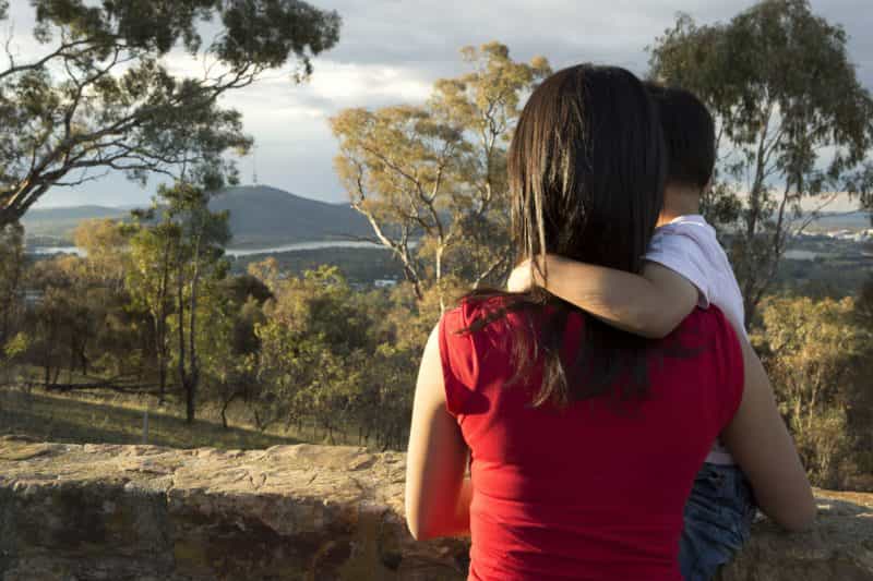 Mother and son looking towards Black Mountain and Telstra Tower