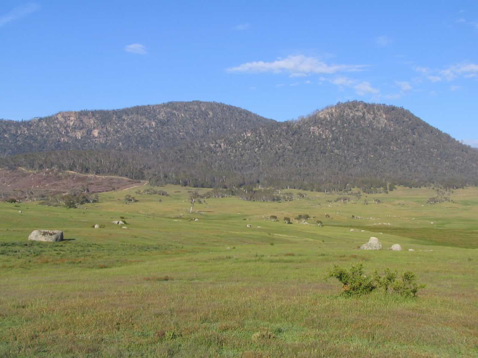 View of ranges with expansive grasslands in the foreground
