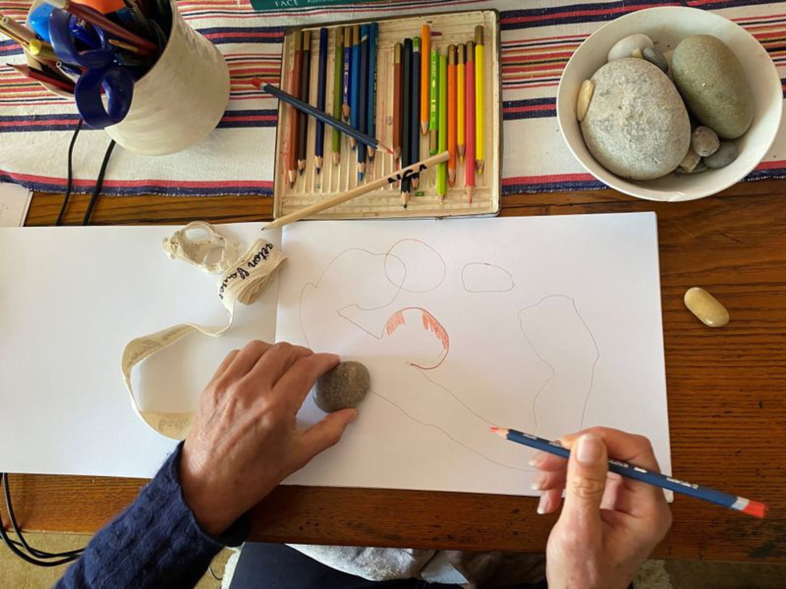 A woman enjoys an online Art and Dementia program at home.