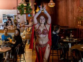 Female belly dancer posing inside Bar Beirut