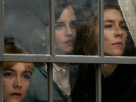 Still from Little Women showing three women looking out a window