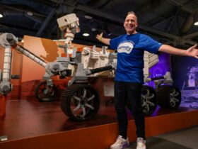 Ryan 'Brickman' McNaught with the Mars Rover Perseverence made from LEGO® bricks