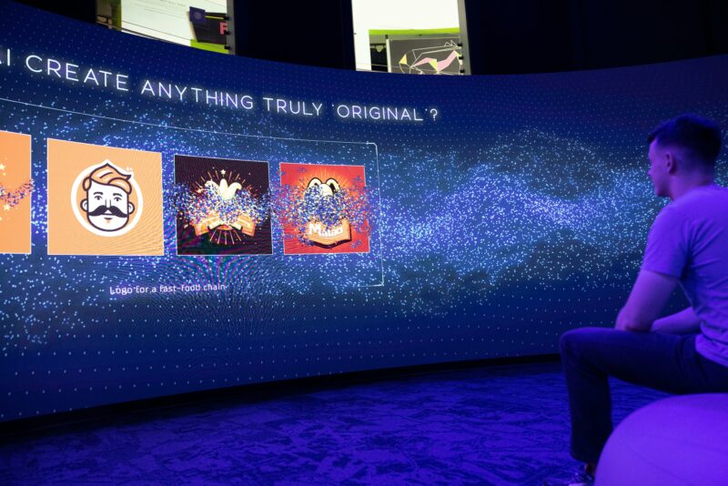 Image of a man watching the AI exhibiton