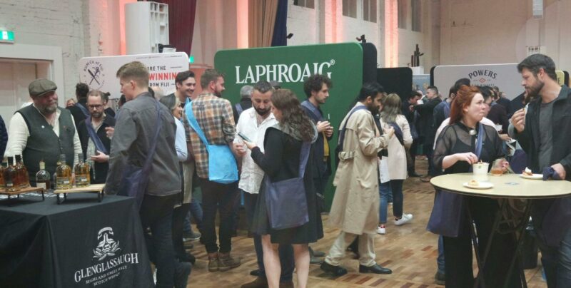 People standing near exhibitors at Whisky Live