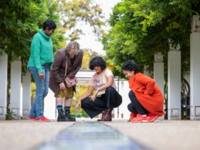 Tour group visits Centenary of Women's Suffrage Fountain