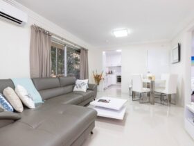 Kitchen, living and dining with spacious lounge and 4 seater dining setting