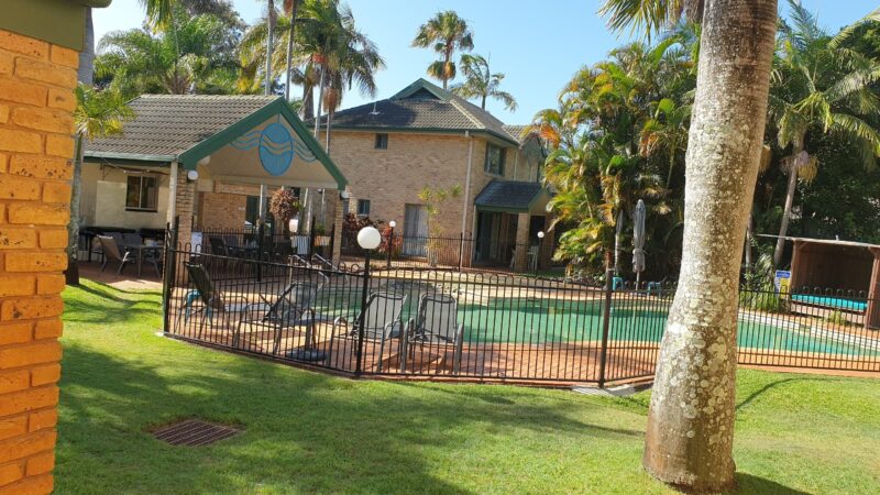 FULLY FENCED POOL WITH DAY BED AND LOUNGES