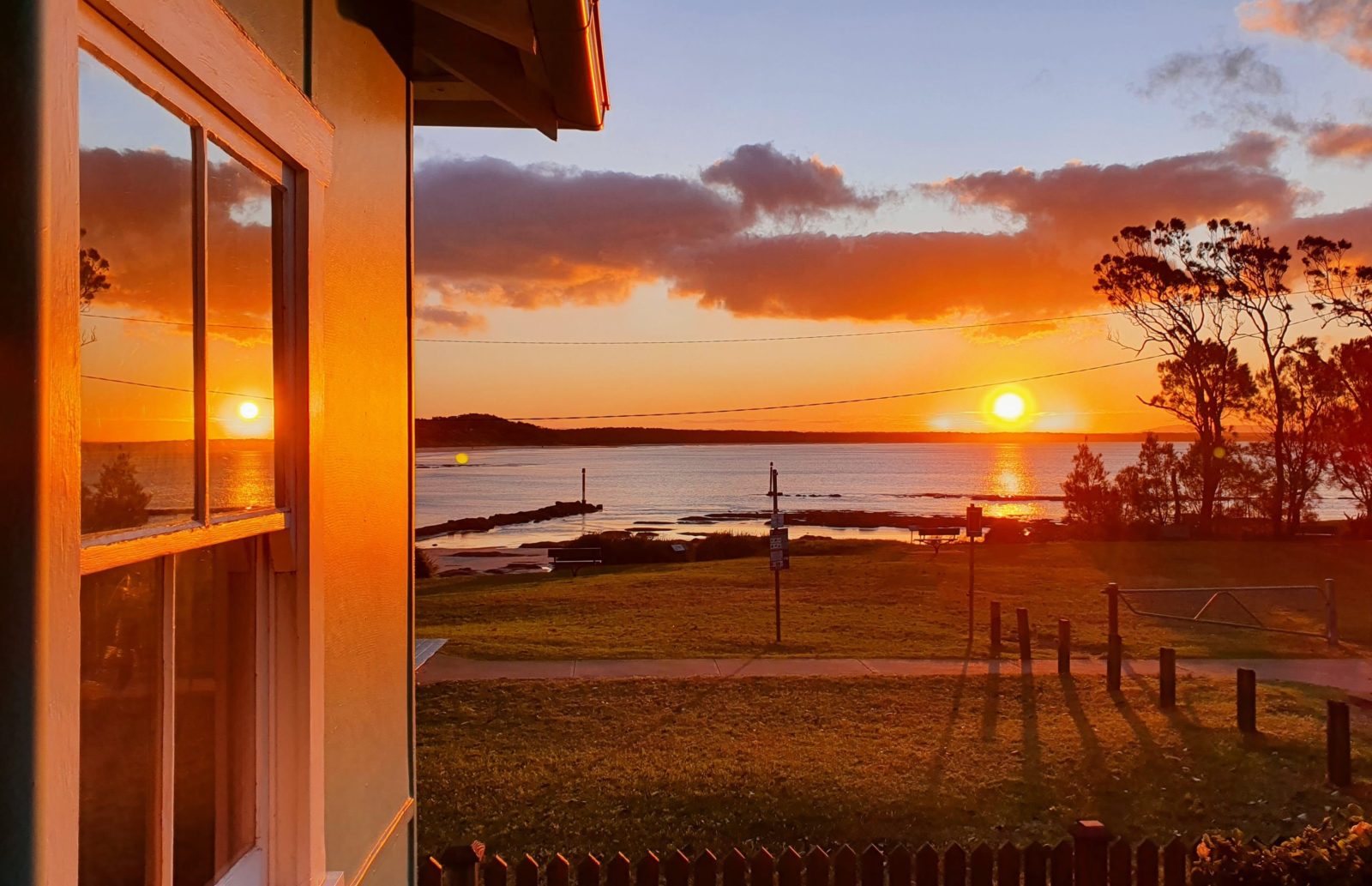 Sunset at Aurora Cottage overlooking Currarong Beach