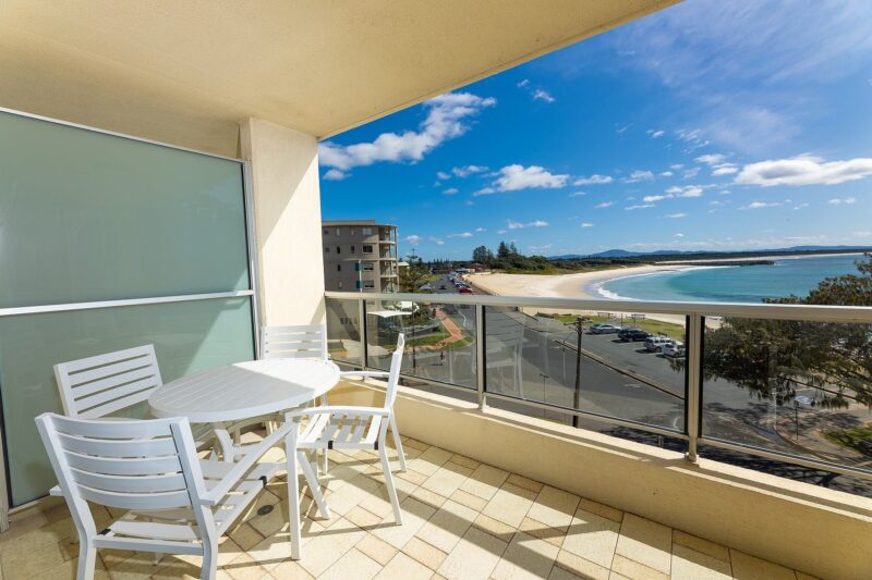 Balcony with 4 seater outdoor setting and beach views