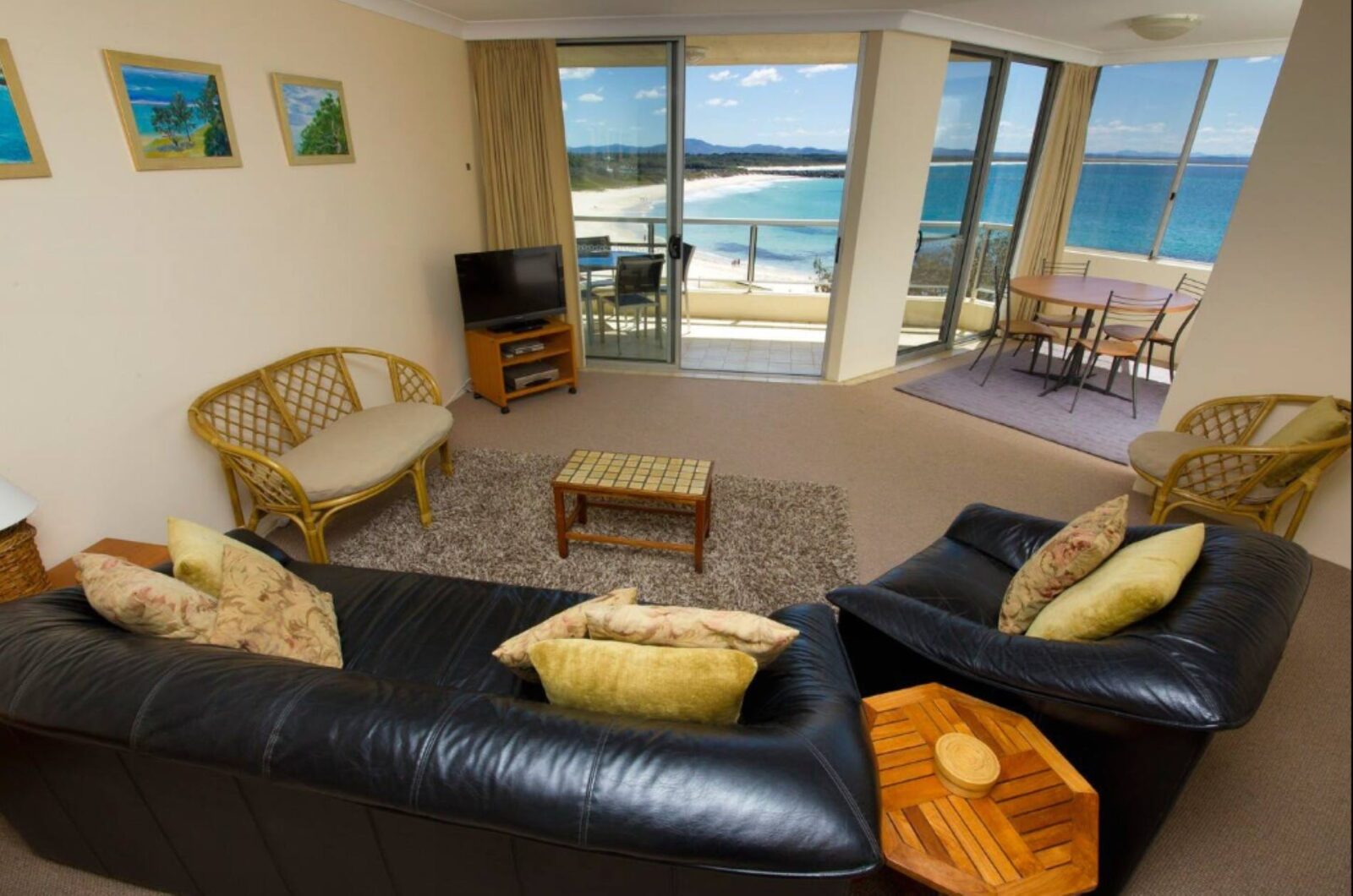 Living room with lounges, TV and ocean views
