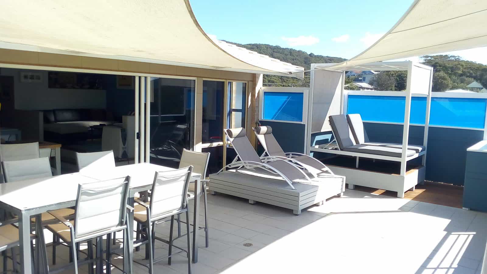 View deck with sunlounges, day bed and otdoor dining & BBQ