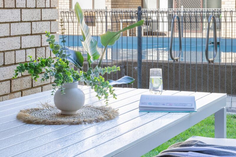 Our al fresco area is right by the pool and offers various seating options