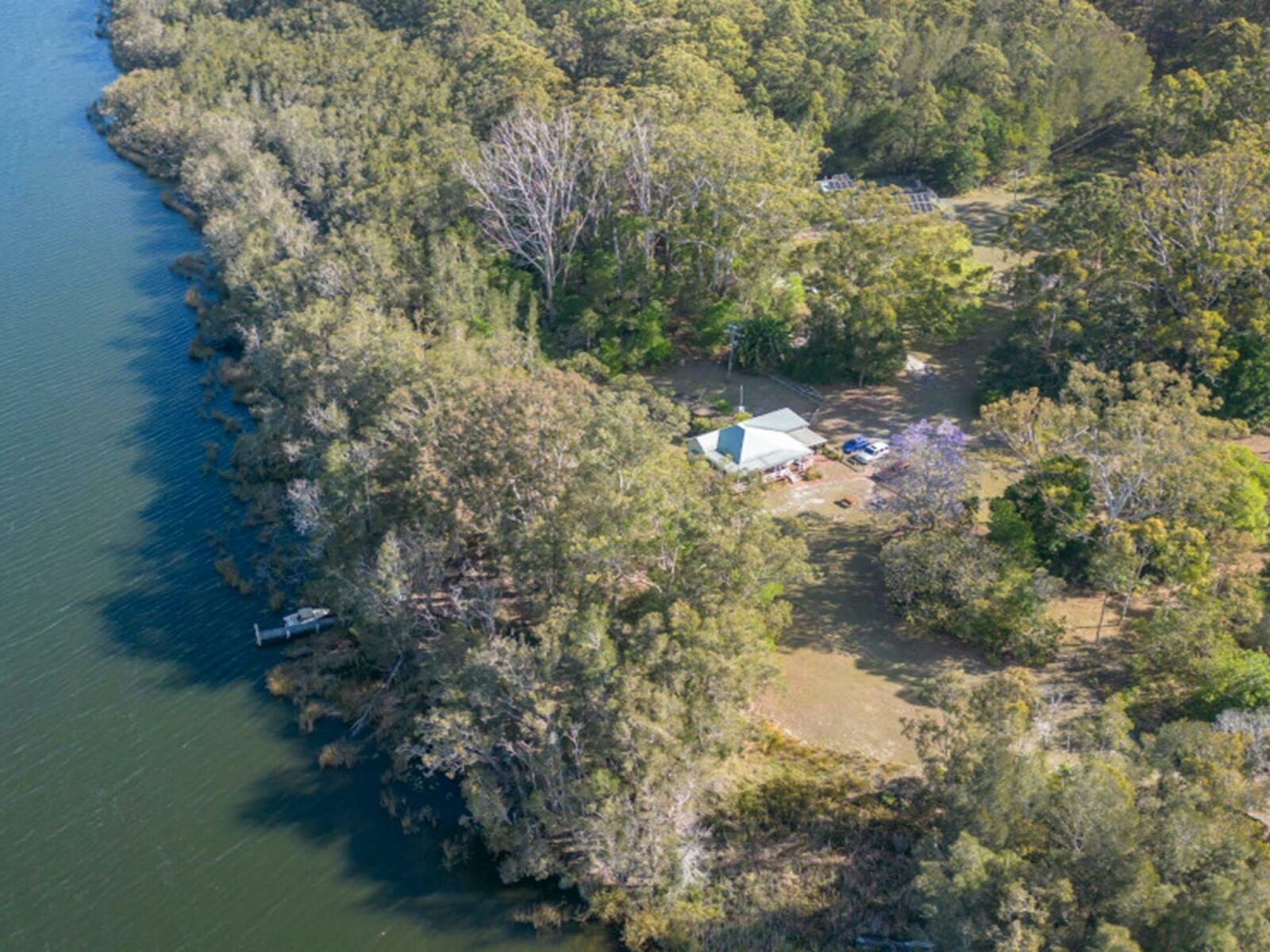 Aerial view of Cutlers Cottage near the lake's edge. Credit: John Spencer © DPE