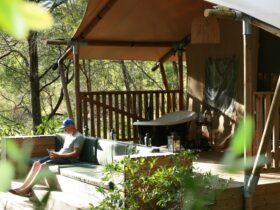 Relaxing on the deck of one of the tented lodges at Ding Dang Doo Ranch